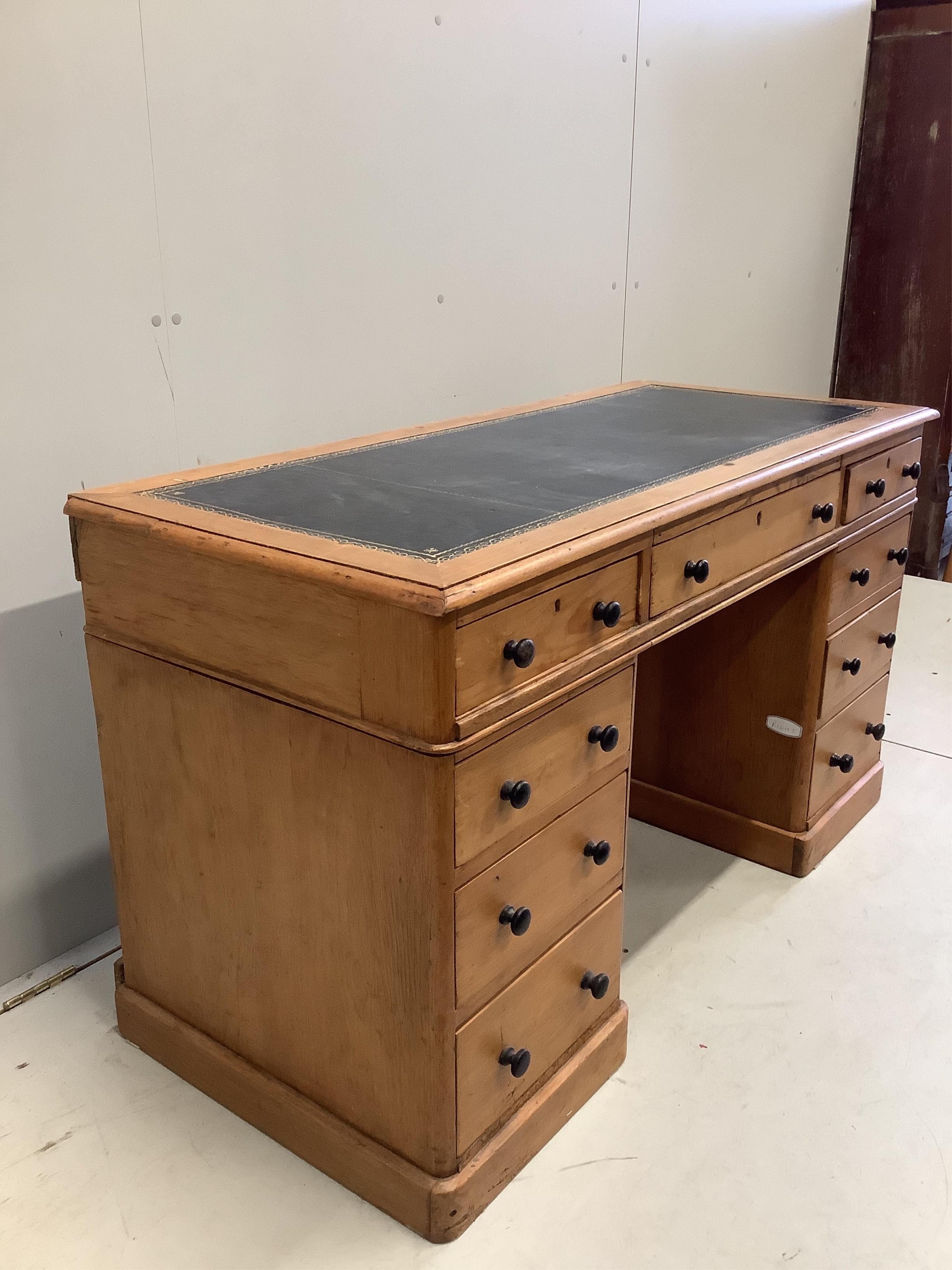 A late Victorian pine pedestal desk, width 131cm, depth 57cm, height 73cm. Condition - fair.